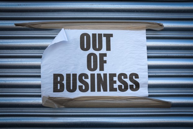 a piece of paper that says out of business on it