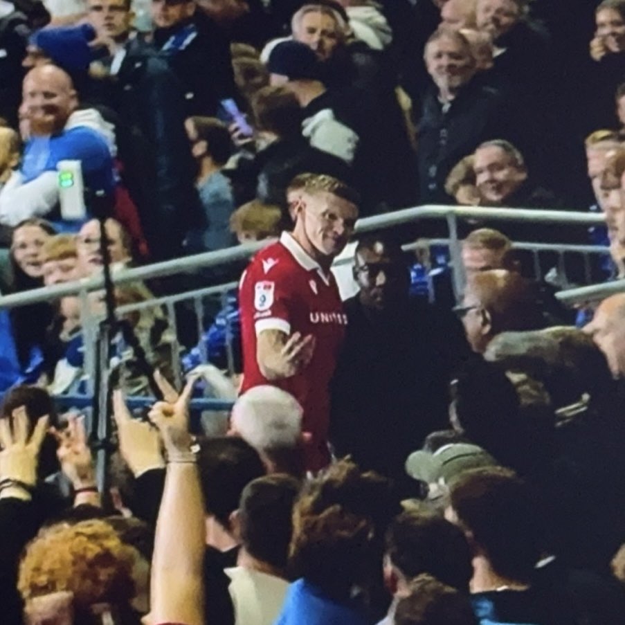 a man in a red jersey with the number 11 on it