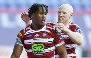 a rugby player wears a jersey that says greenmount projects