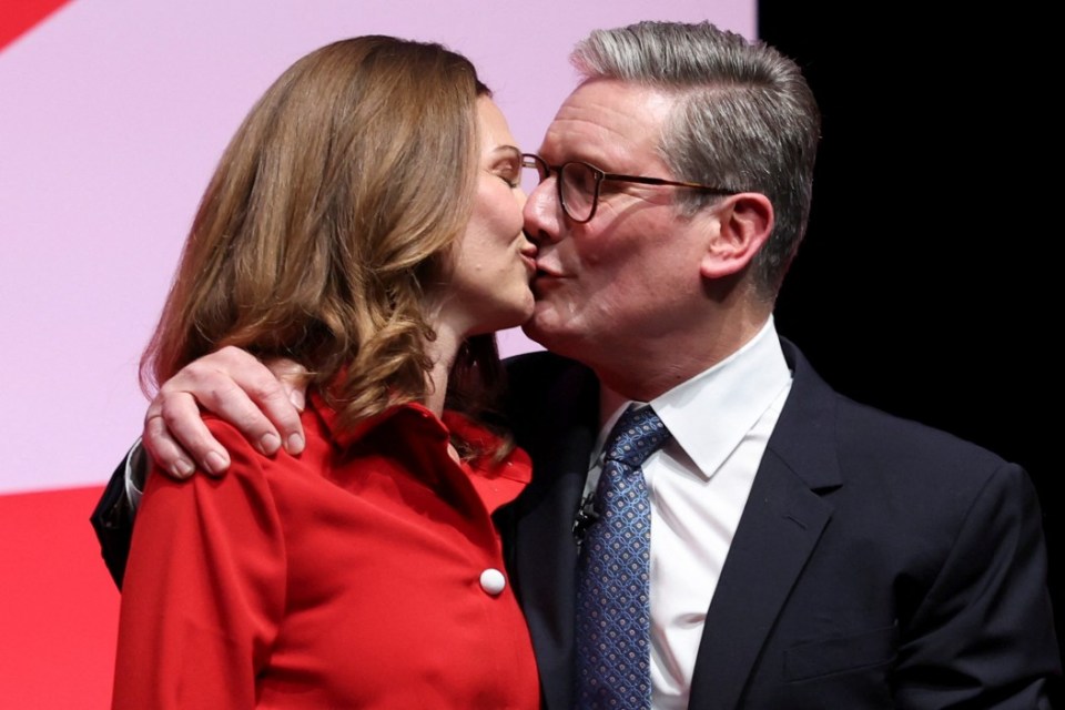 British Prime Minister Keir Starmer kisses his wife Victoria Starmer at Britain's Labour Party's annual conference in Liverpool, Britain, September 24, 2024. REUTERS/Phil Noble
