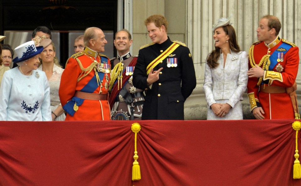 FILE PHOTO: (Front L-R) Britain's Queen Elizabeth, Prince Philip, Prince Harry, Prince William, the Duke of Cambridge and his wife, Catherine, the Duchess of Cambridge share a light moment as they stand on the balcony of Buckingham Palace in the annual Trooping of the Colour ceremony to celebrate the Queen's official birthday in central London, June 14, 2014. REUTERS/Toby Melville/File Photo