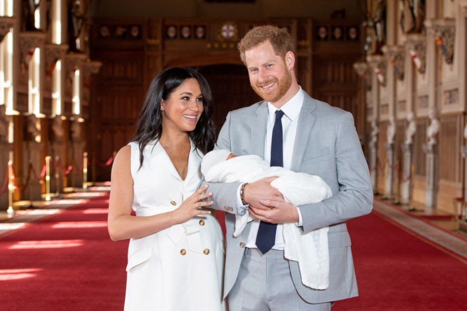FILE PHOTO: Britain's Prince Harry and Meghan, Duchess of Sussex are seen with their baby son, who was born on Monday morning, during a photocall in St George's Hall at Windsor Castle, in Berkshire, Britain May 8, 2019. Dominic Lipinski/Pool via REUTERS/File Photo