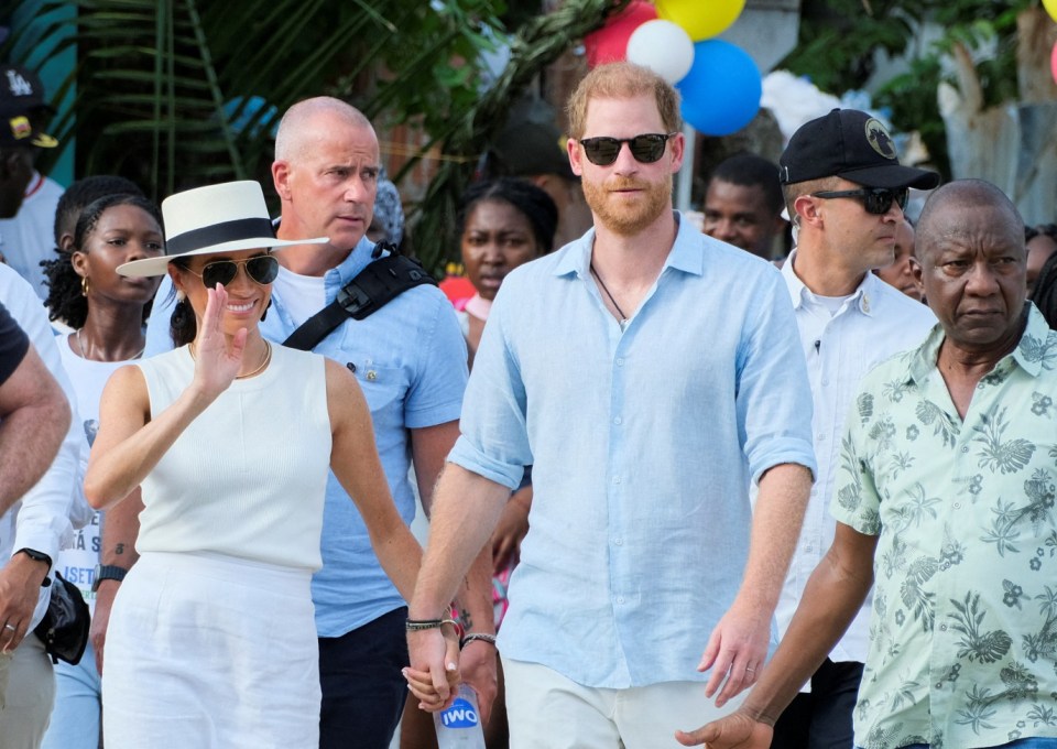 FILE PHOTO: Britain's Prince Harry and his wife Meghan, Duchess of Sussex, walk together in San Basilio de Palenque, Colombia August 17, 2024. REUTERS/Rafael Bossio/File Photo