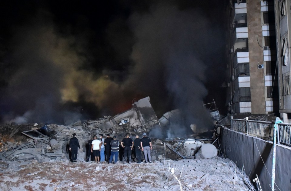 Mandatory Credit: Photo by Fadel Itani/UPI/REX/Shutterstock (14744344f) Lebanese army soldiers and people gather at the scene of Israeli air strikes in the Haret Hreik neighbourhood of Beirut's southern suburbs on Friday on September 27, 2024. A source close to Hezbollah said the massive Israeli strikes on Beirut's southern suburbs flattened six buildings, The Israeli army stated that it targeted Hassan Nasrallah, the leader of Lebanese Hezbollah. Israeli Strikes on Beirut's Southern Suburbs Flattened Six Buildings, Lebanon - 27 Sep 2024