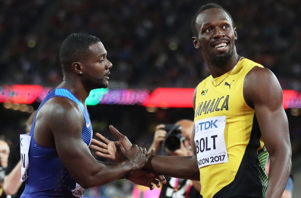 a man wearing a jamaica shirt shakes hands with another man