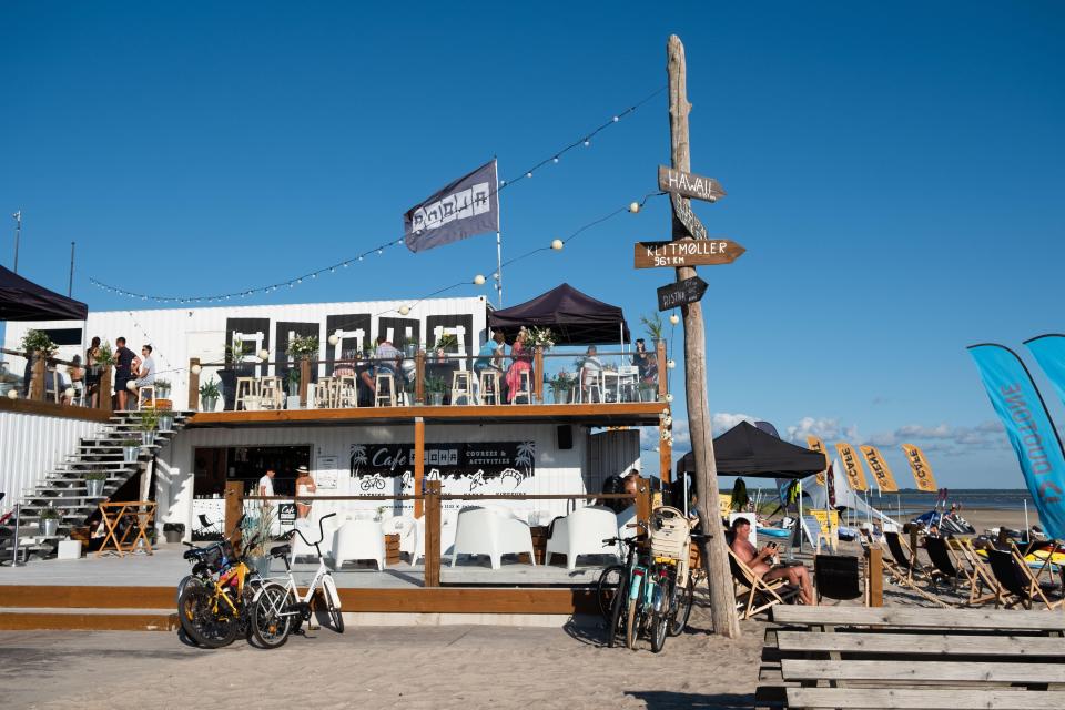 a white building with a sign that says ' goodlife ' on it