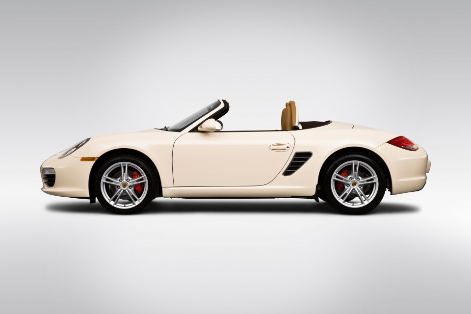 a white convertible sports car with the top down