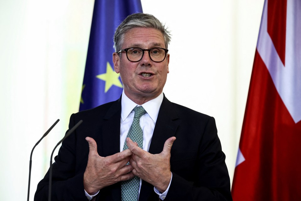 a man in a suit and tie is giving a speech