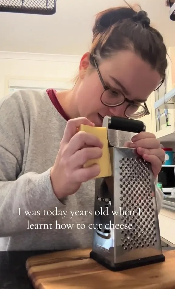 a woman wearing glasses is grating cheese with the words " i was today years old when i learnt how to cut cheese " below her