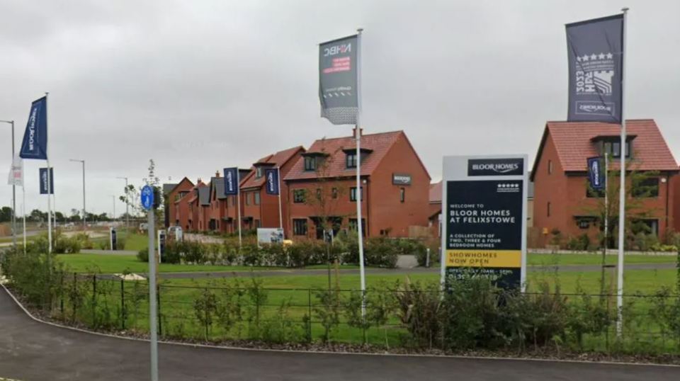 a row of houses with a sign that says welcome to bloor homes at felixstowe