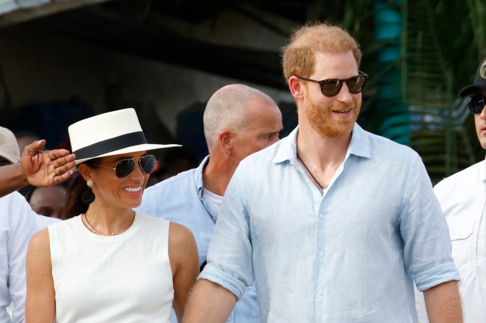 a man and a woman are holding hands and smiling
