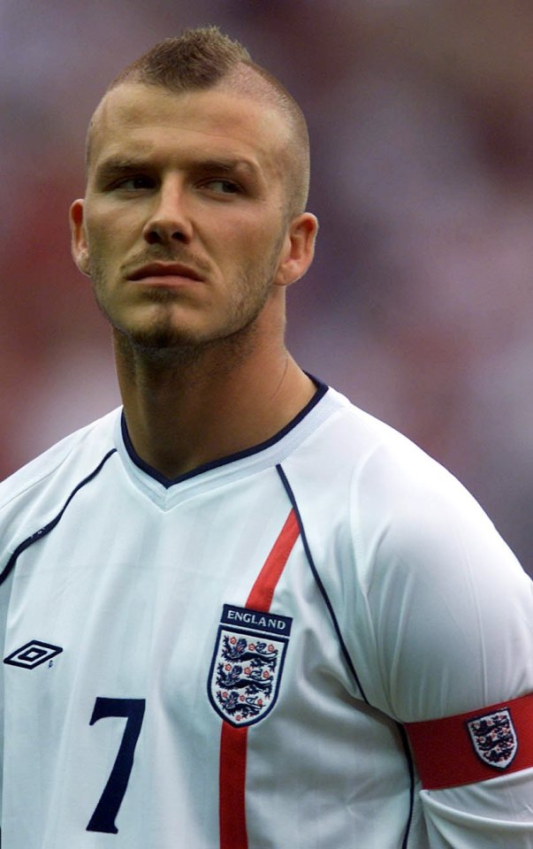 a man wearing an england jersey with the number 7 on it