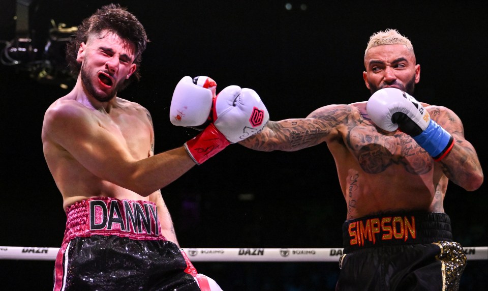 a boxer with the word simpson on his shorts
