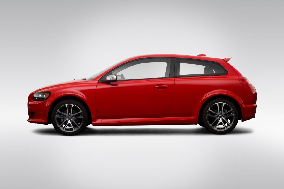 a red car with black rims and a white background