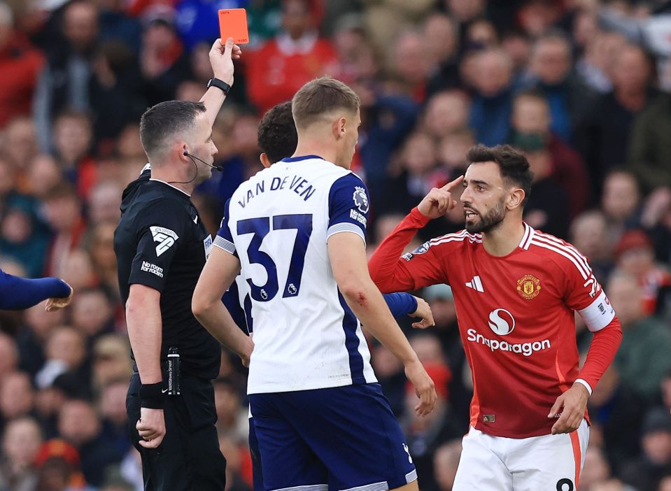 a man in a van de ven jersey is getting a red card