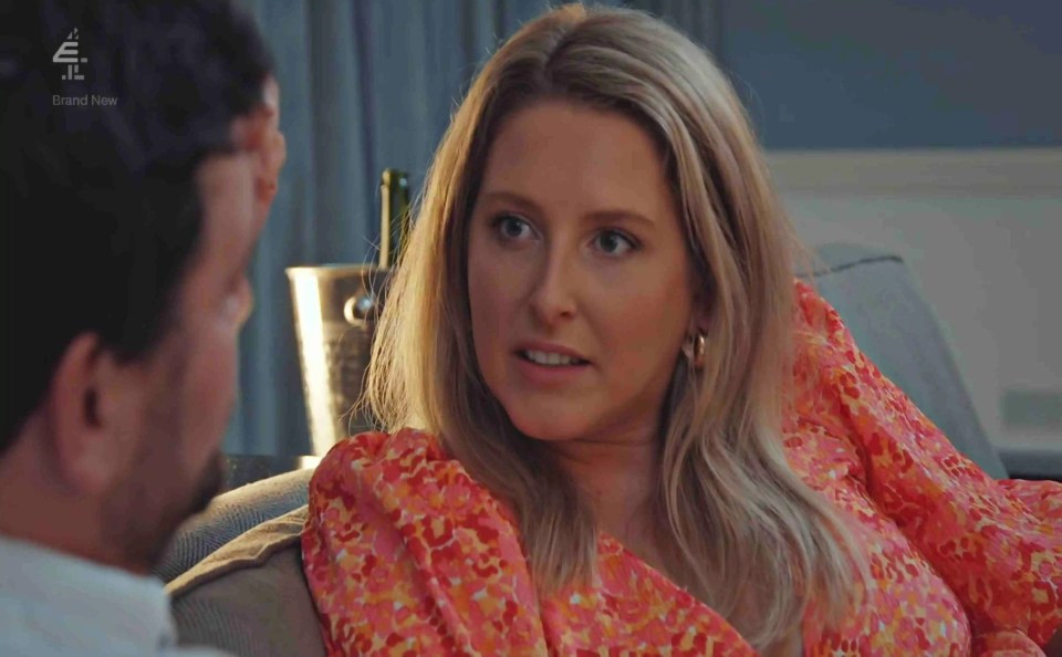 a woman in a pink dress sits next to a man on a couch with brand new on the screen