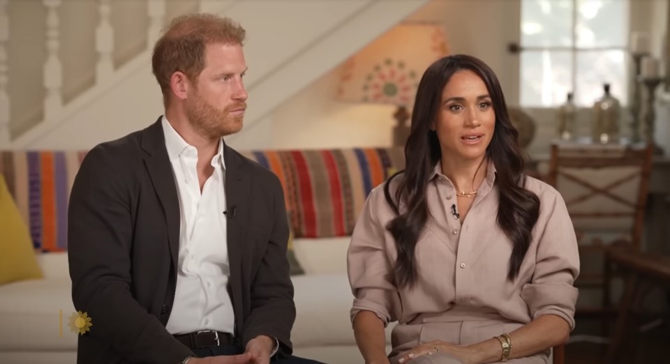 a man and a woman are sitting next to each other on a couch