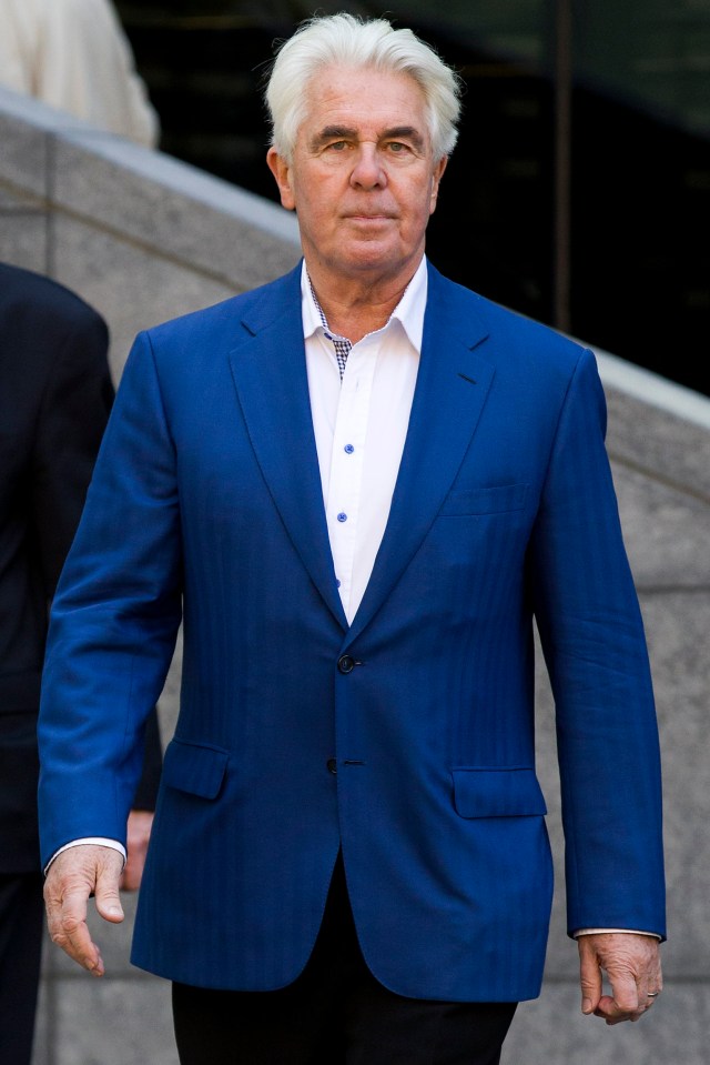 a man in a blue suit and white shirt