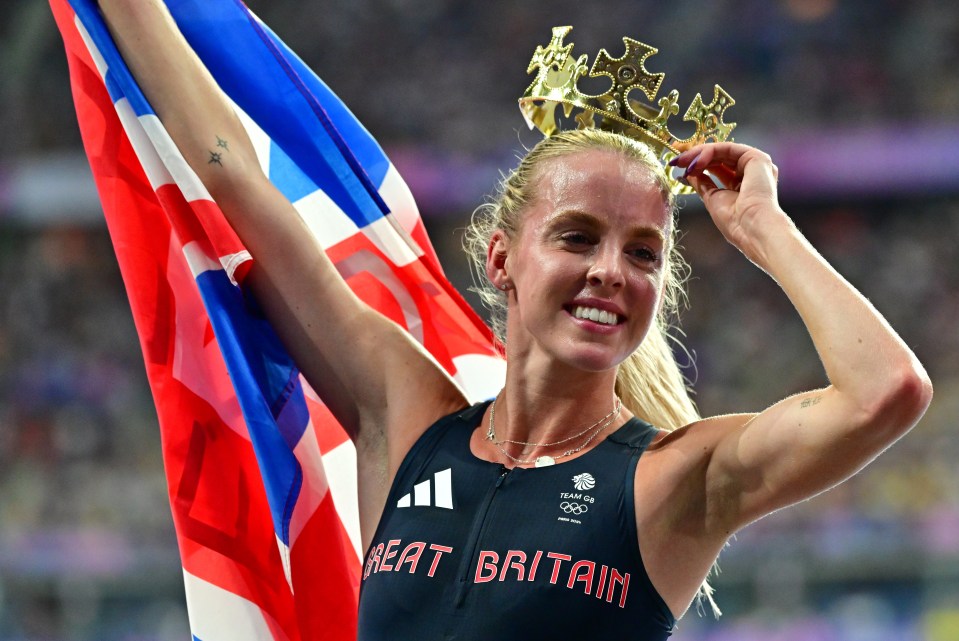a woman wearing a great britain tank top holds a flag