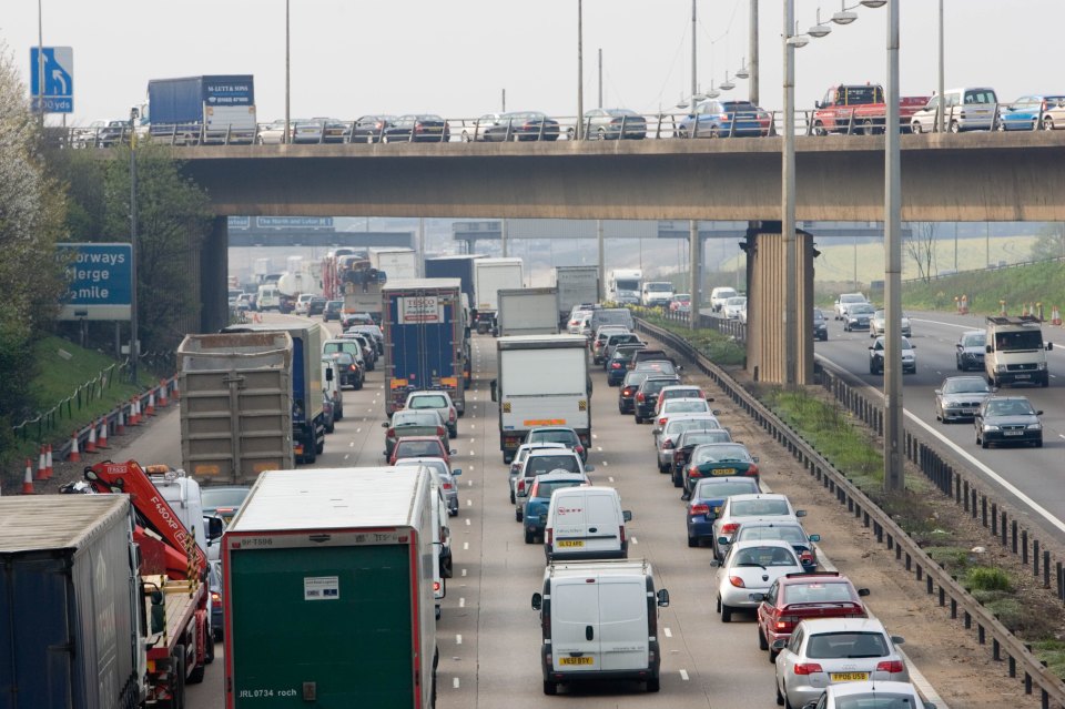 a busy highway with a sign that says always larger mile