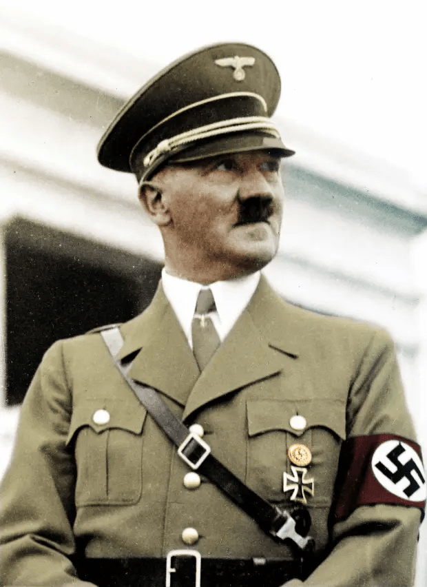 a man in a military uniform with a eagle on his hat