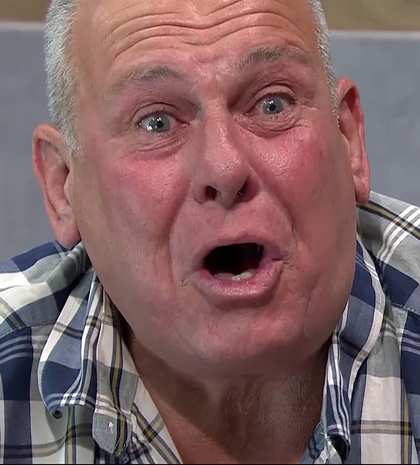a man in a plaid shirt is making a funny face