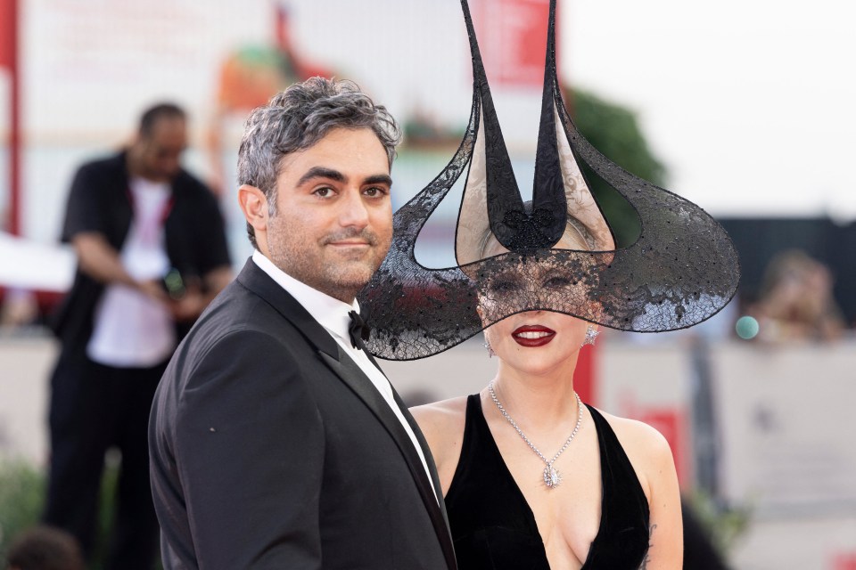 a man and a woman are posing for a picture