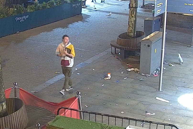 a man walking in front of a sign that says paolo mart