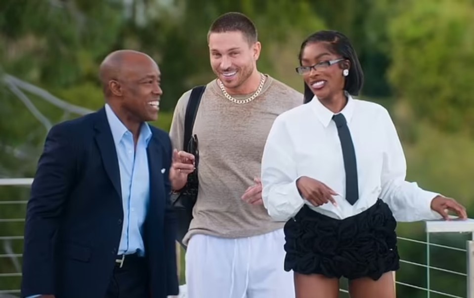 two men and a woman are standing next to each other