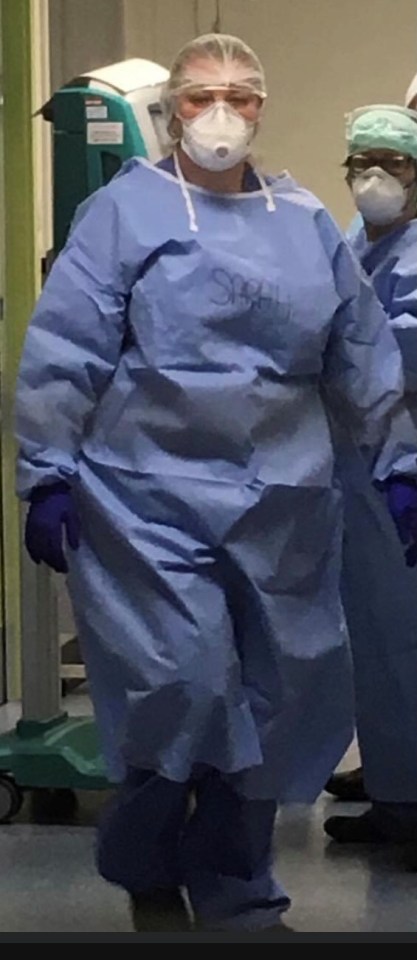 a woman in a surgical gown with the word surgical on it