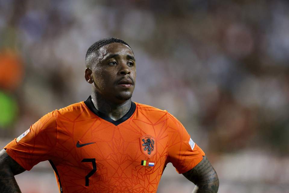 a man wearing an orange jersey with the number 7 on it