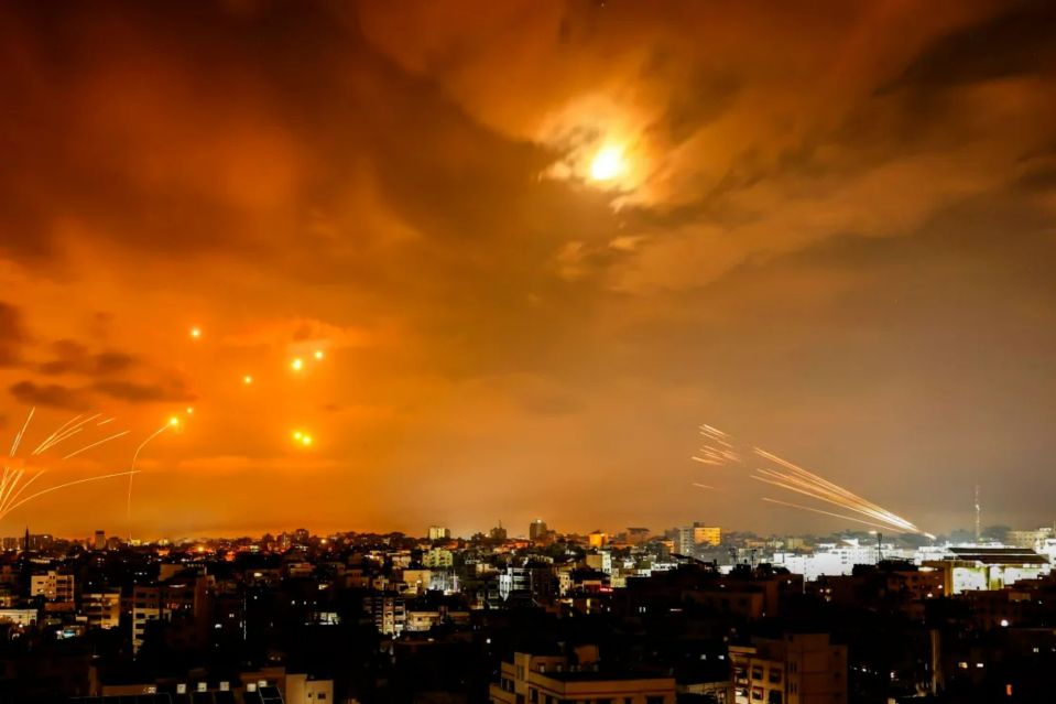 a fireworks display over a city at night