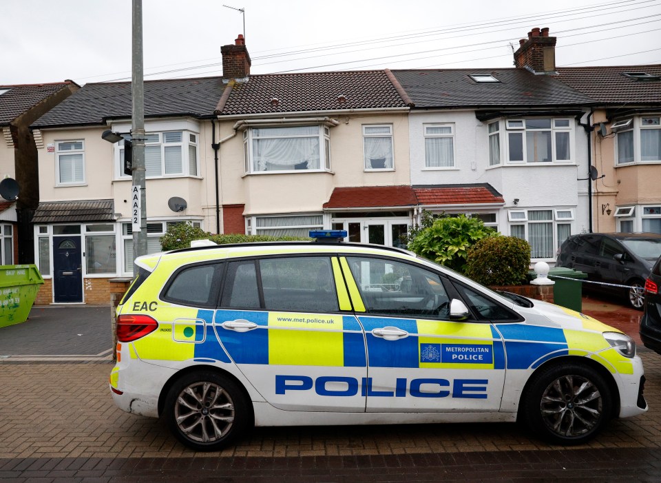 a police car is parked in front of a house