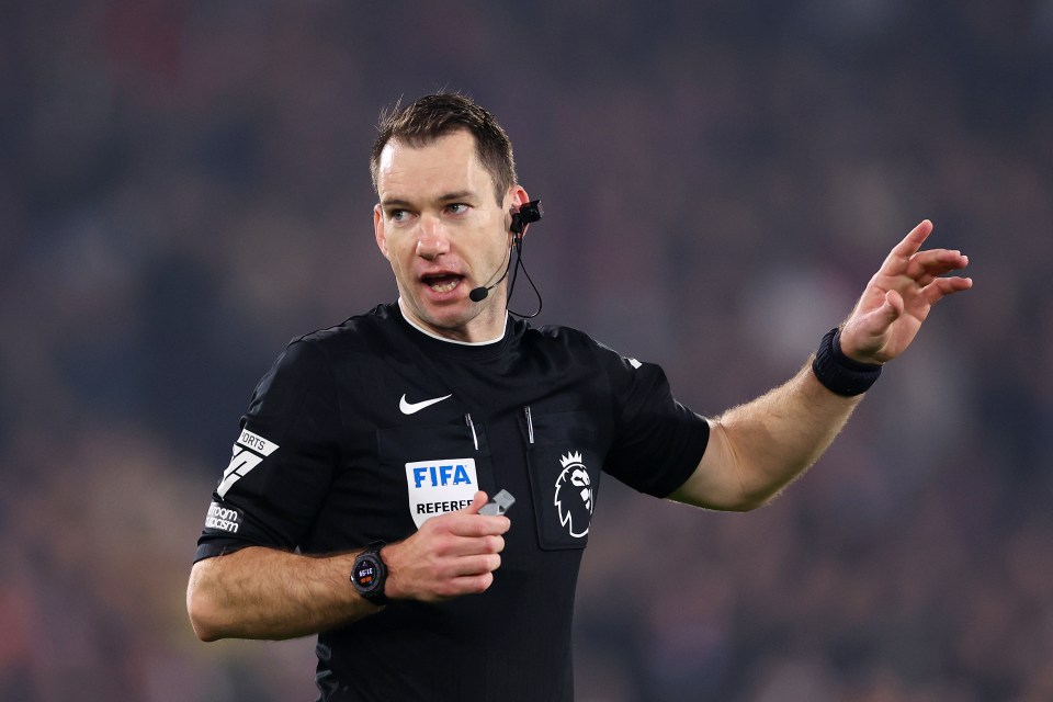 a referee is wearing a fifa referee shirt