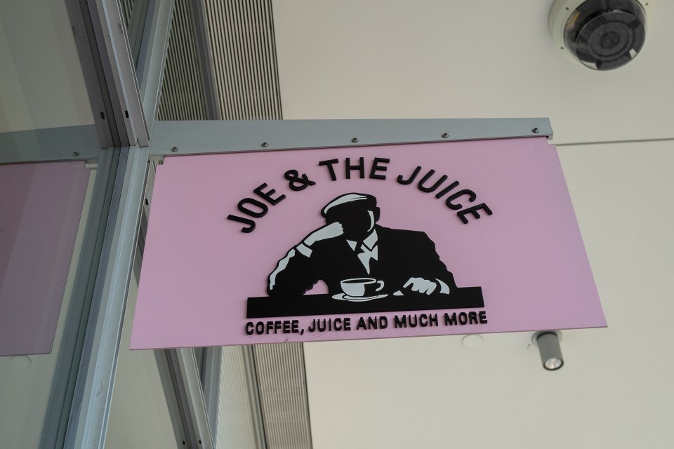 a sign that says joe & the juice coffee juice and much more