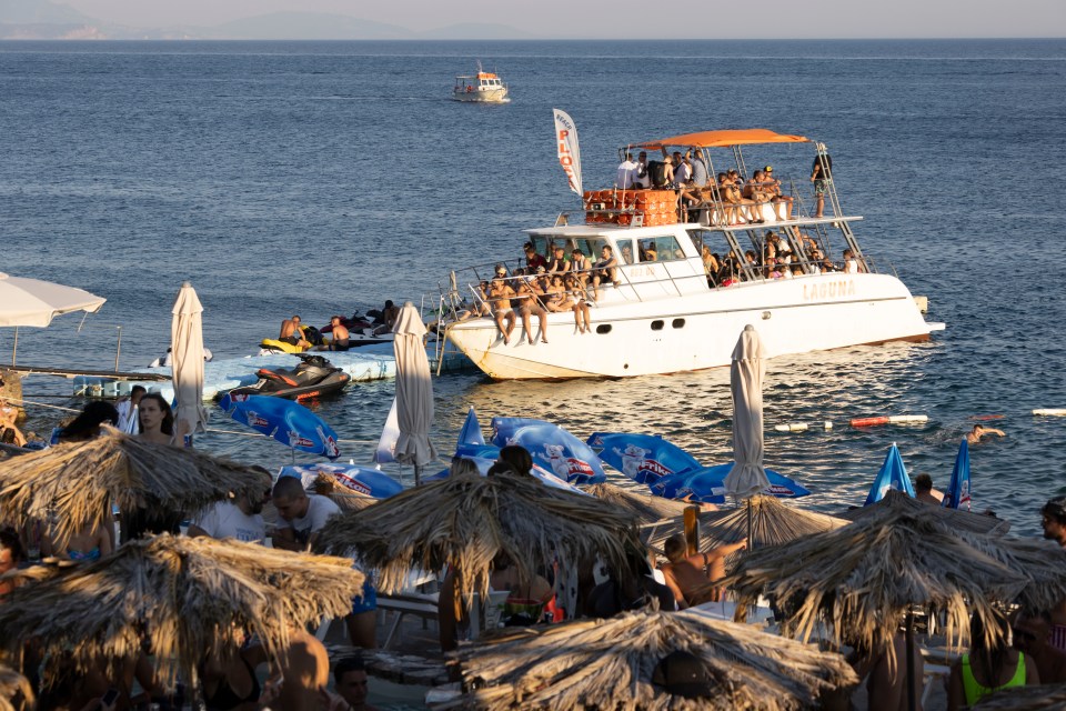 a boat with a sign on top that says coca cola
