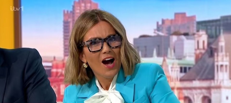 a woman wearing glasses and a blue jacket is making a funny face .