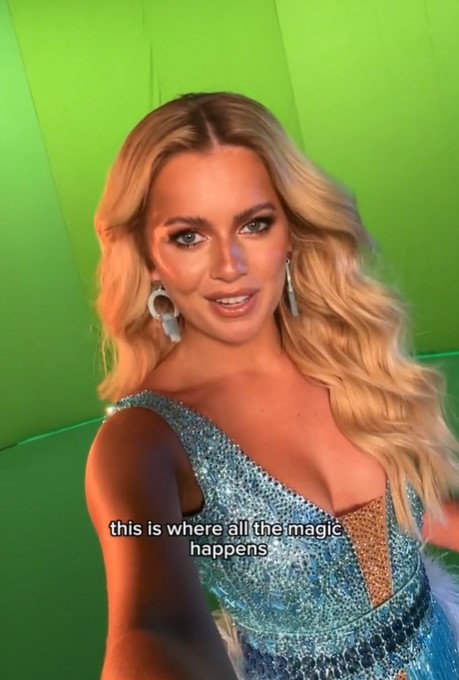 a woman in a blue dress says this is where all the magic happens