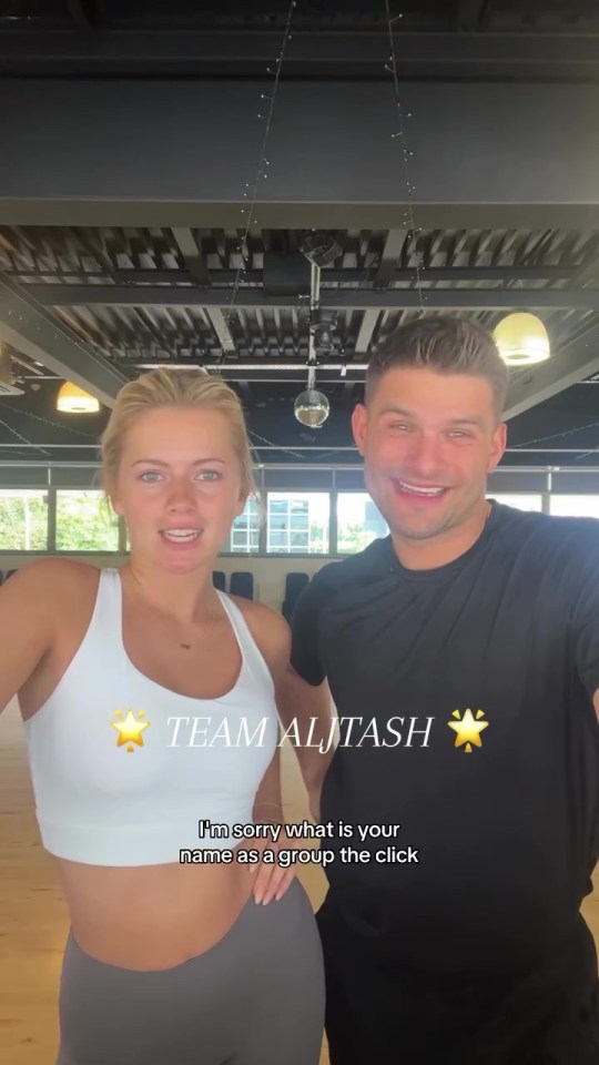 a man and a woman are posing for a picture and the woman says team alitash