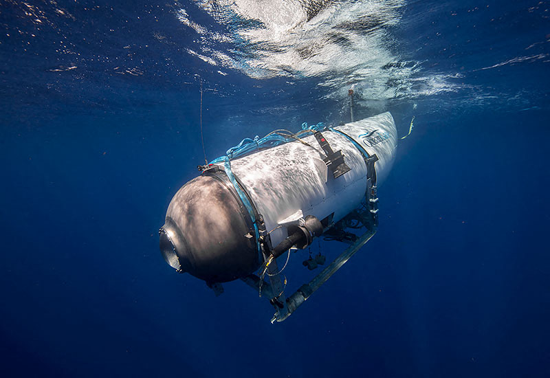 a submarine is floating in the ocean with a blue rope around it