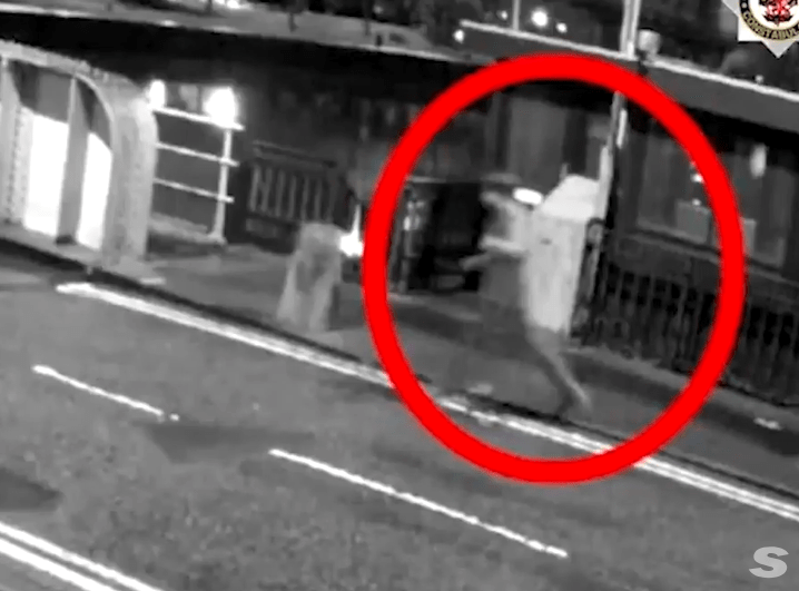 a black and white photo of a person in a red circle