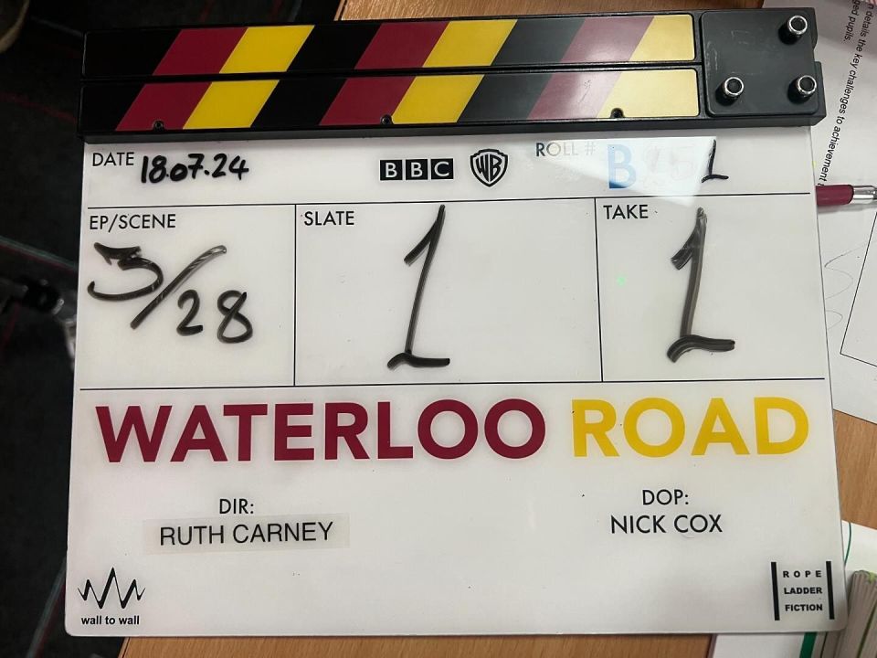 a clapper board with waterloo road written on it