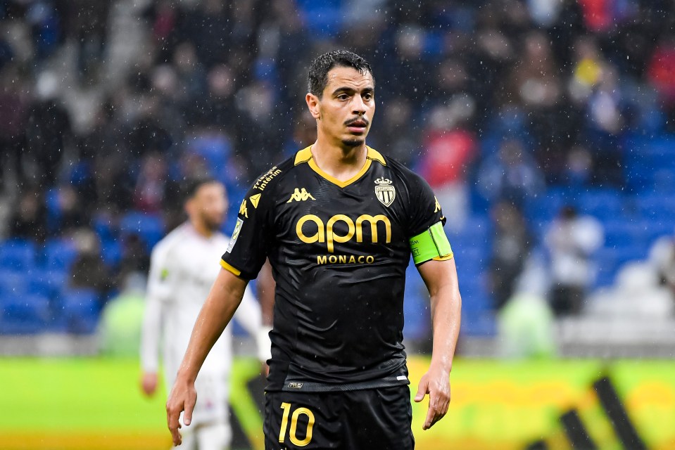 a soccer player wearing a black jersey that says apm monaco