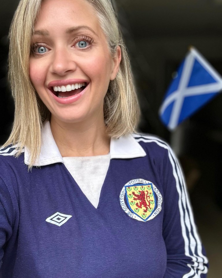 a woman wearing a shirt that says scotland on it