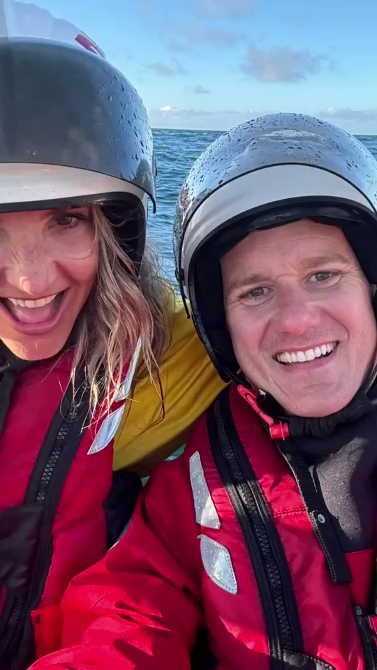 a man and a woman wearing helmets are smiling for the camera