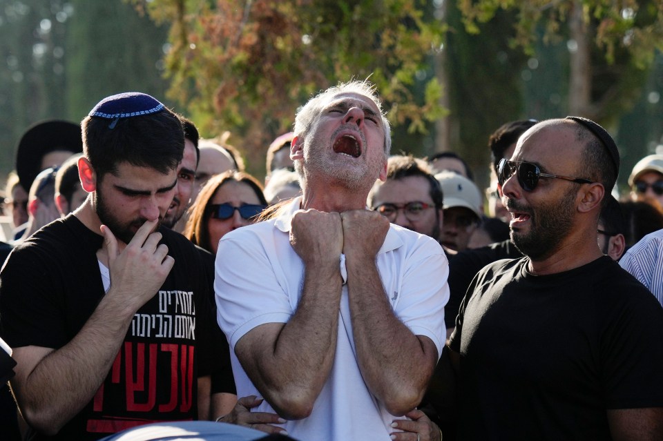 a man wearing a shirt that says ' hebrew ' on it