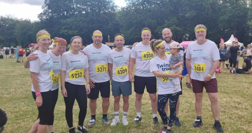 a group of people wearing shirts that say twin trust
