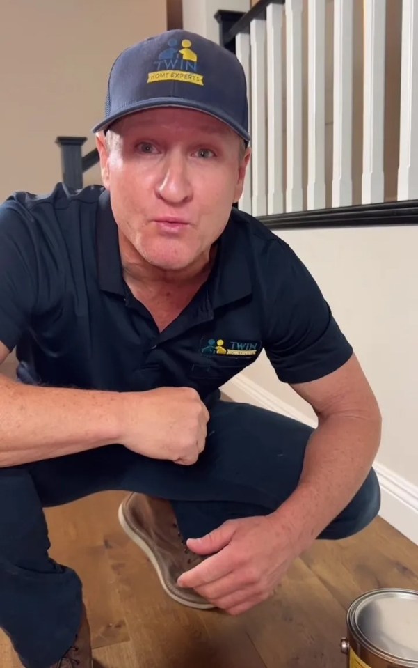 a man wearing a hat that says home expert