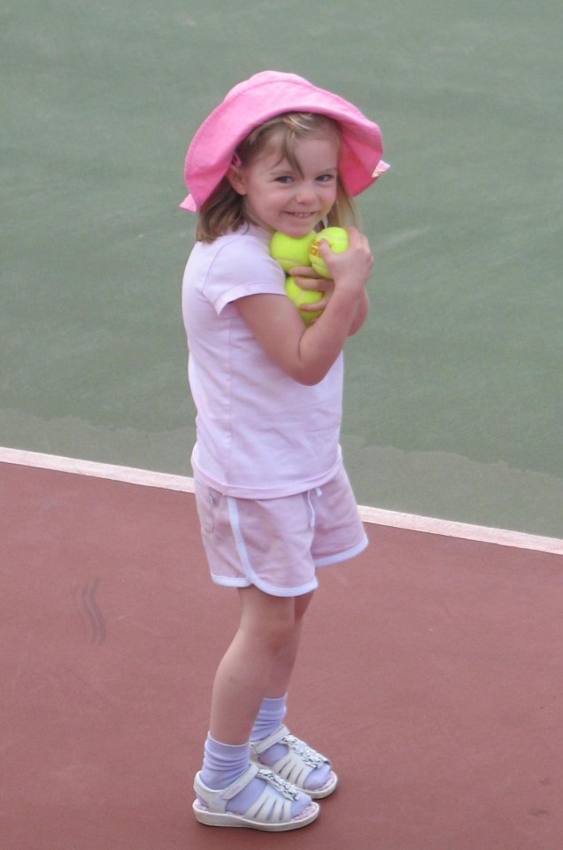 a little girl wearing a pink hat is holding two tennis balls