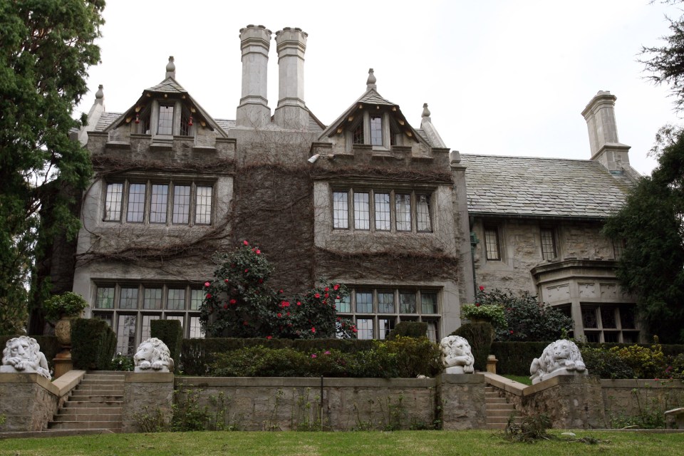 a large house with a lot of windows and stairs